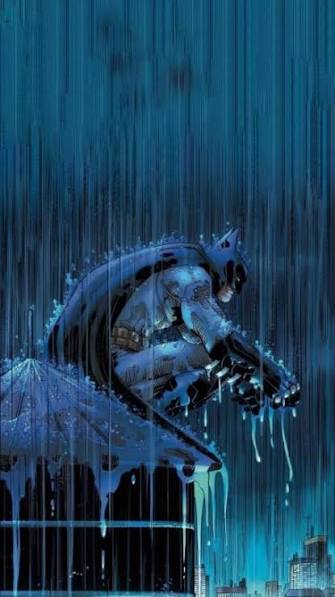 Batman standing in the rain